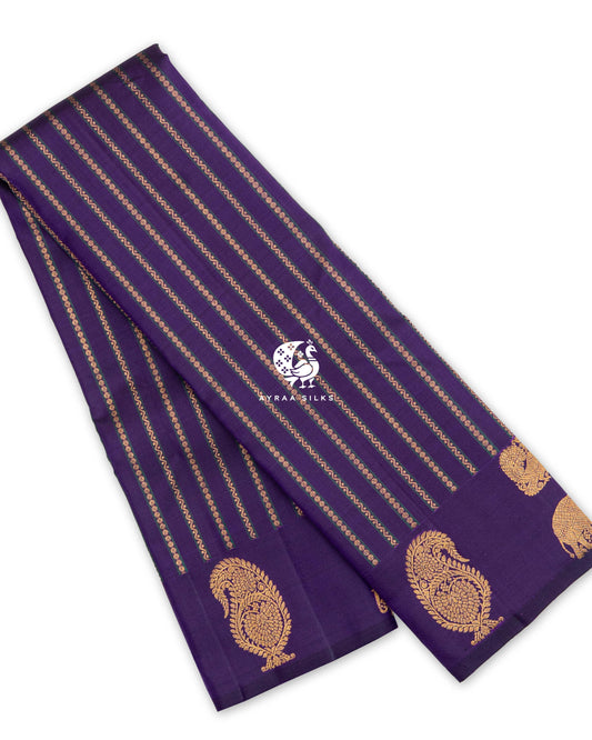 Purple Butta Kanchipuram silk saree, folded, with zari stripes and manga (paisley) zari buttas on a self colour border