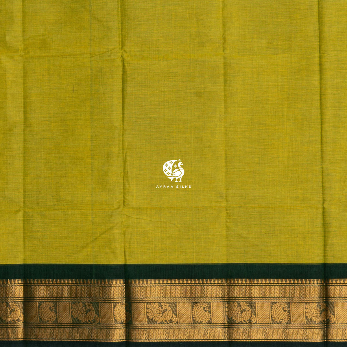 Close view of the running blouse and bottle green zari border with peacock and paisley motifs