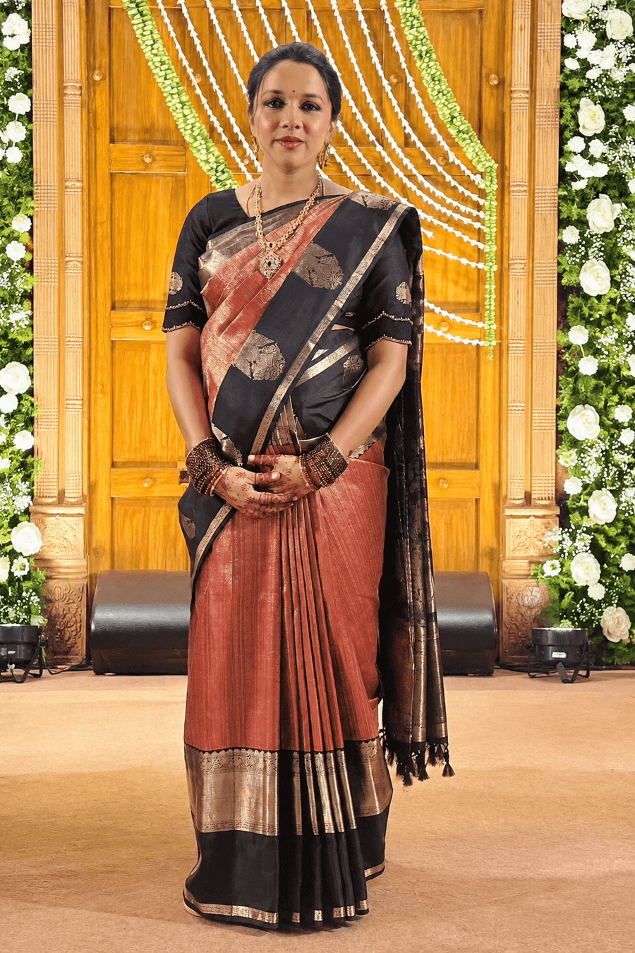 Woman wearing an Ayraa Silks saree