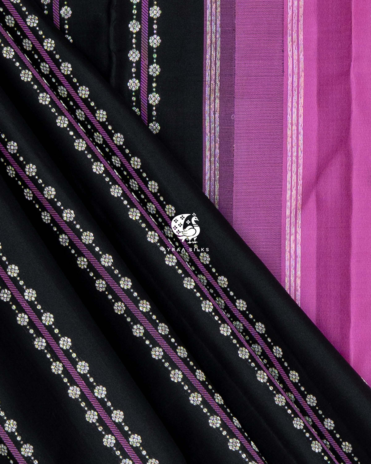 Black silk with purple stripes and floral zari buttas beside the orchid pink blouse edge with zari lines