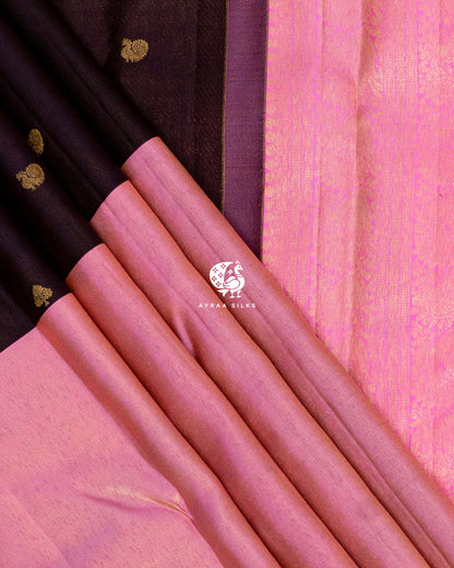 Rose pink zari band and coffee brown silk pleats with peacock zari buttas beside the bright pink zari pallu border
