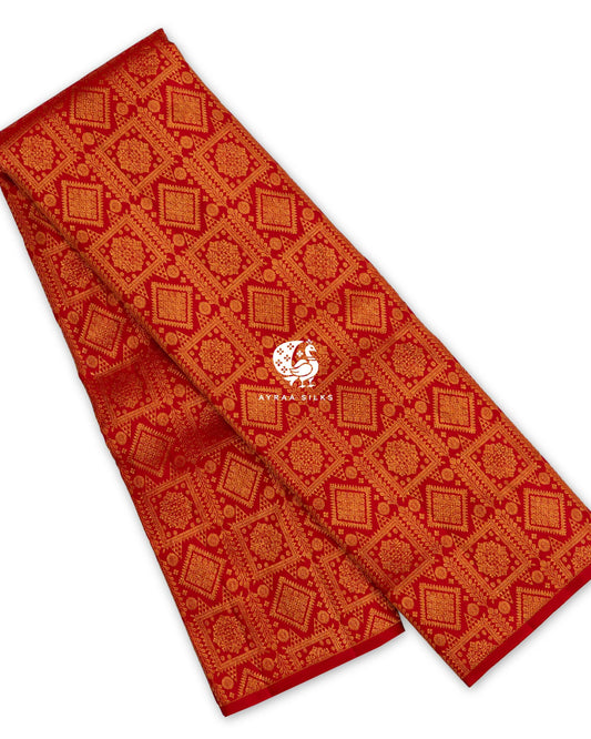 Red pure Kanchipuram silk saree folded, woven in all-over zari brocade with floral medallions