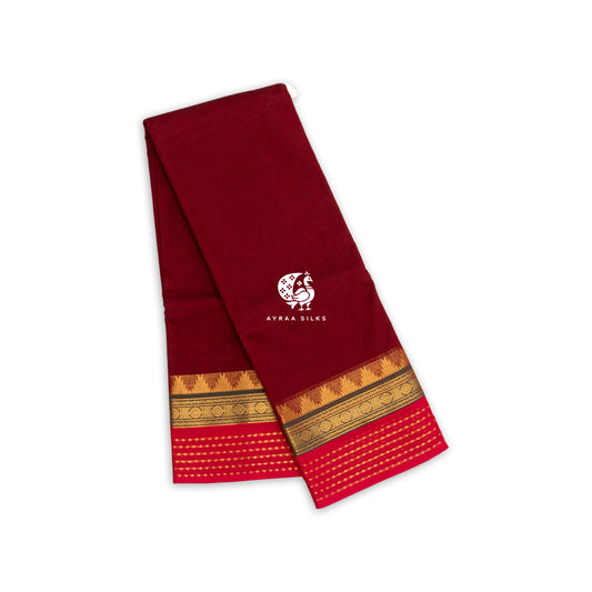 Maroon Kanchi cotton saree folded, showing the gold zari temple border banded in green and finished in pink — Ayraa Nithya by Ayraa Silks
