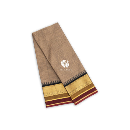 Beige handwoven Kanchi cotton saree with a black and gold zari temple border, folded