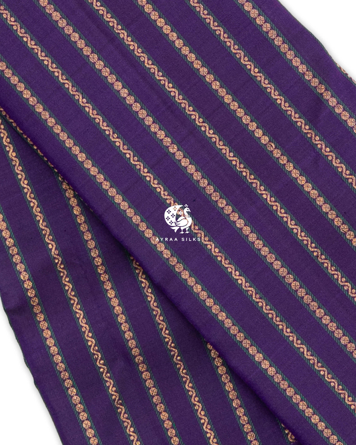Close view of zari Vari (stripes) in floral and wave lines edged in green on purple pure Kanchipuram silk