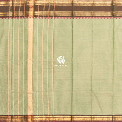 Pista green Kanchi cotton saree laid flat, pallu with zari lines and the brown zari temple border