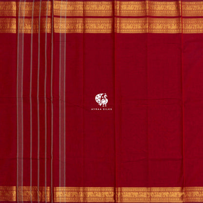 Red Kanchi cotton saree laid flat, pallu with stripes and the gold zari elephant border