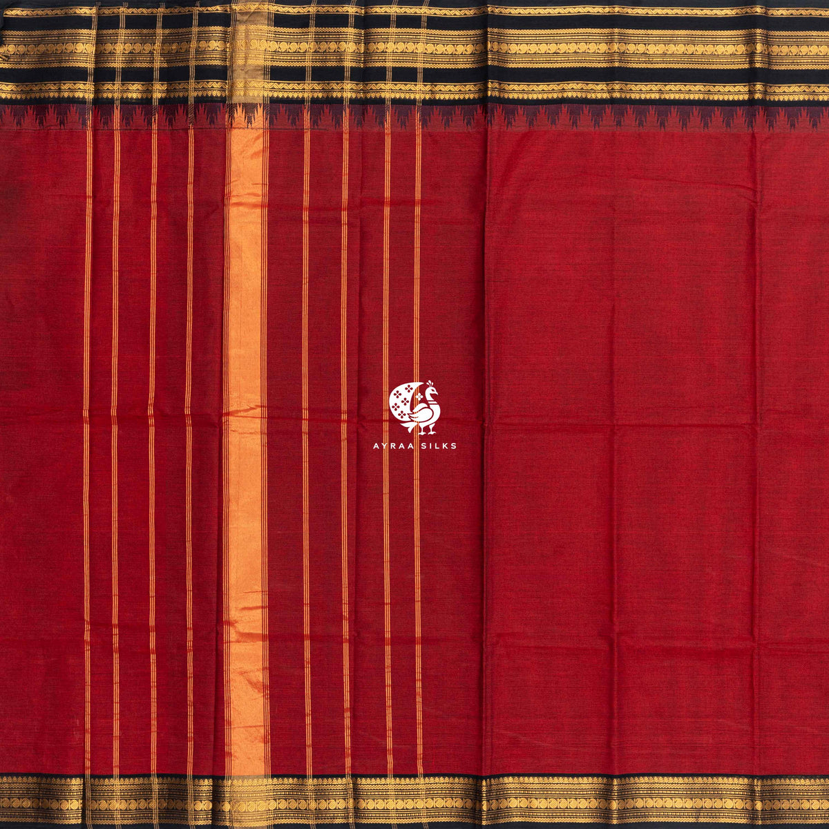 Red Kanchi cotton saree laid flat, pallu with zari lines and the black and gold zari temple border