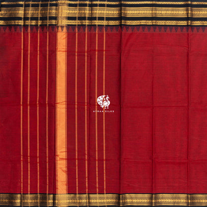 Red Kanchi cotton saree laid flat, pallu with zari lines and the black and gold zari temple border