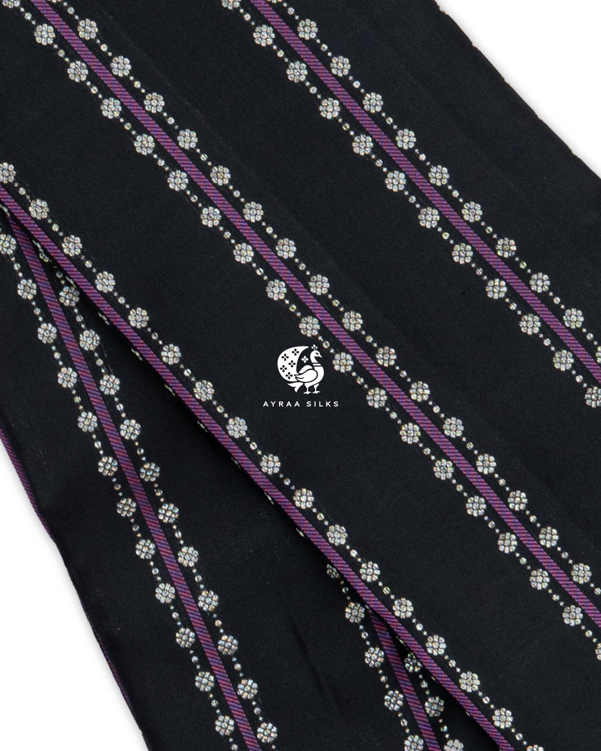 Close view of purple Vari (stripes) flanked by silver-toned floral zari buttas on black pure Kanchipuram silk