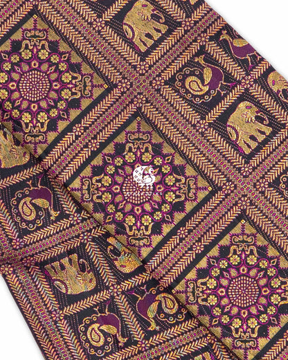 Close view of zari brocade with purple threadwork, showing floral medallions and Yanai (elephant) and Mayil (peacock) motifs