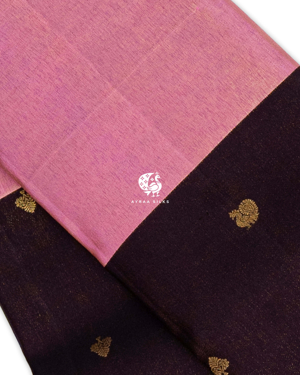 Close view of the rose pink zari band beside coffee brown zari by zari silk with Mayil (peacock) zari buttas