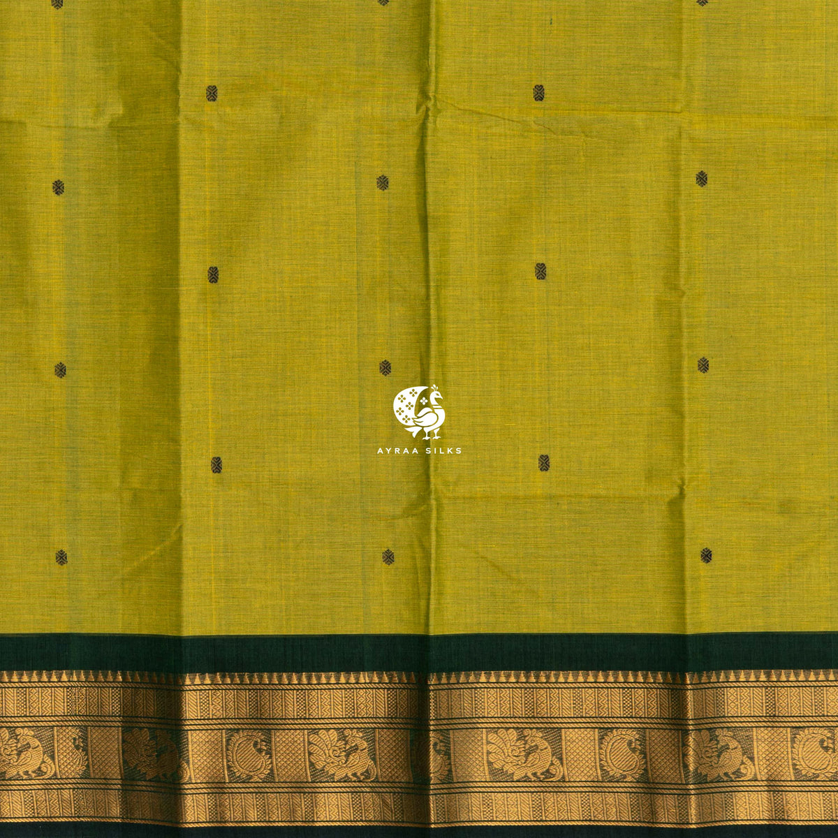 Bottle green buttas woven across the mehendi green cotton body