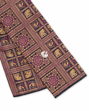 Black Yanai Mayil Brocade Kanchipuram silk saree folded, showing the fine black edge and zari checks with elephant and peacock motifs