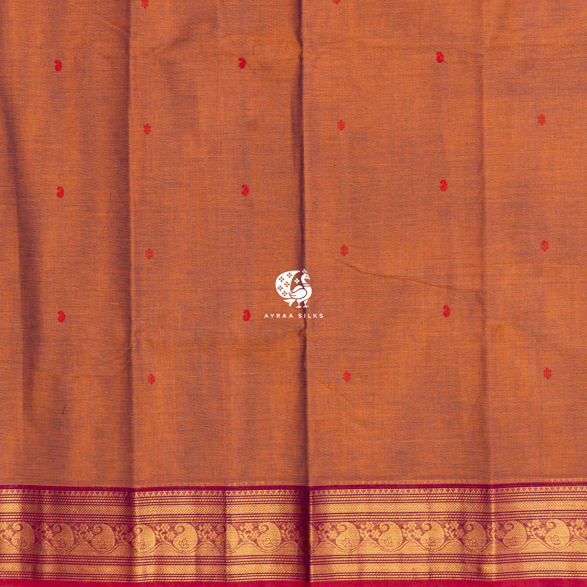 Red thread buttas across the rust body, meeting the magenta zari border