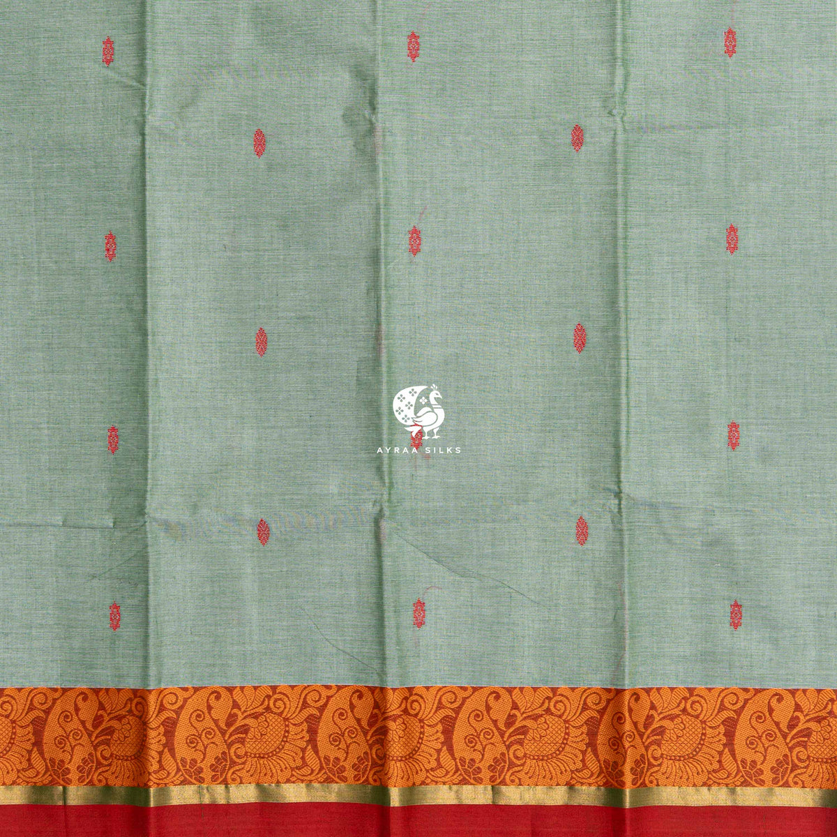 Red thread buttas across the sage green body, meeting the orange paisley border
