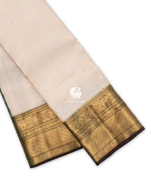Cream Zari Manga Kanchipuram silk saree folded, showing the wide antique gold zari border with Yanai (elephant) and Mayil (peacock) medallions