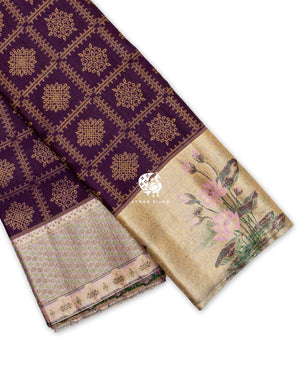 Jamun purple Kanchipuram pattu saree showing its two borders, a gold zari tissue lotus border and a pastel floral zari border