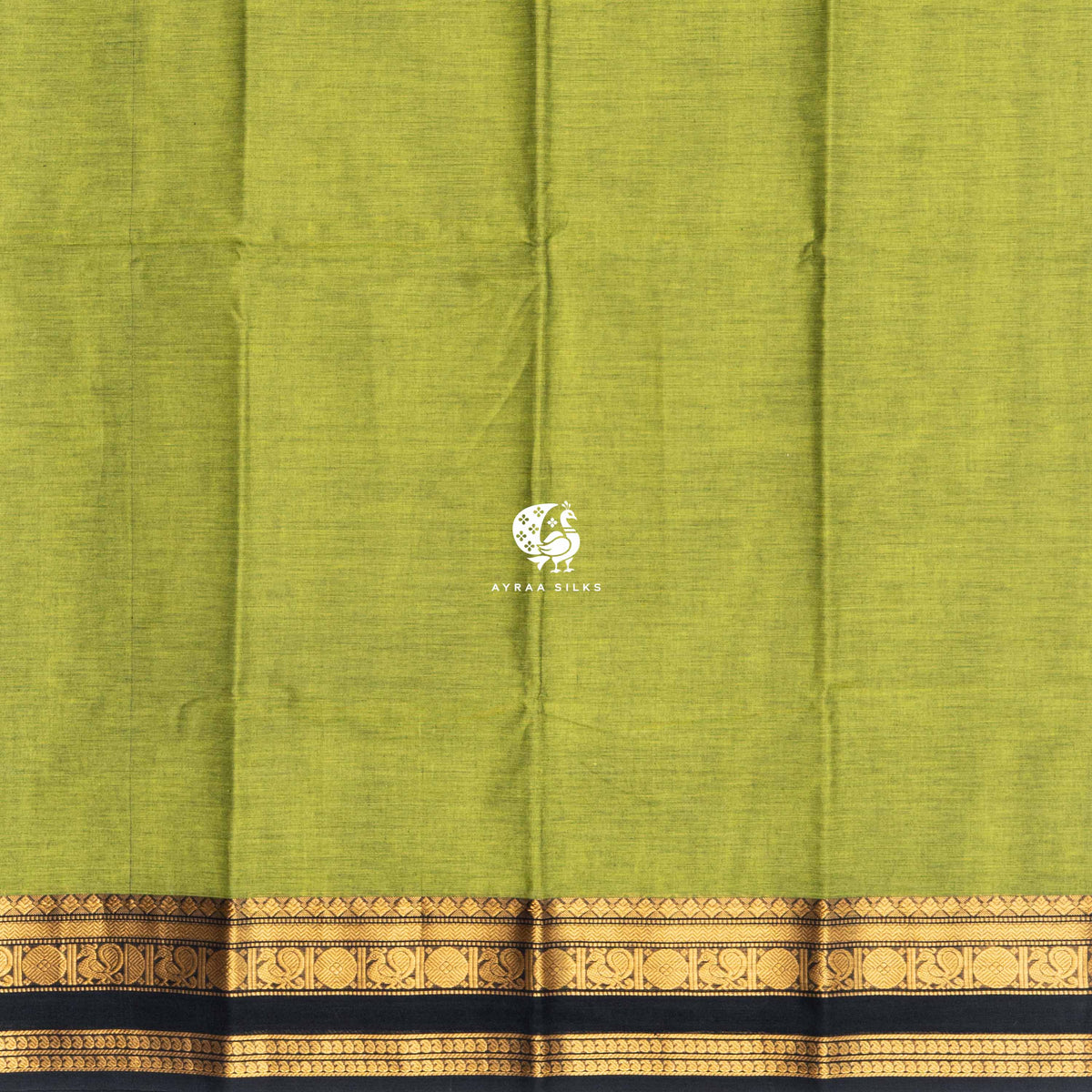 Plain mehendi green cotton body meeting the black and gold zari peacock border