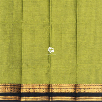 Plain mehendi green cotton body meeting the black and gold zari peacock border