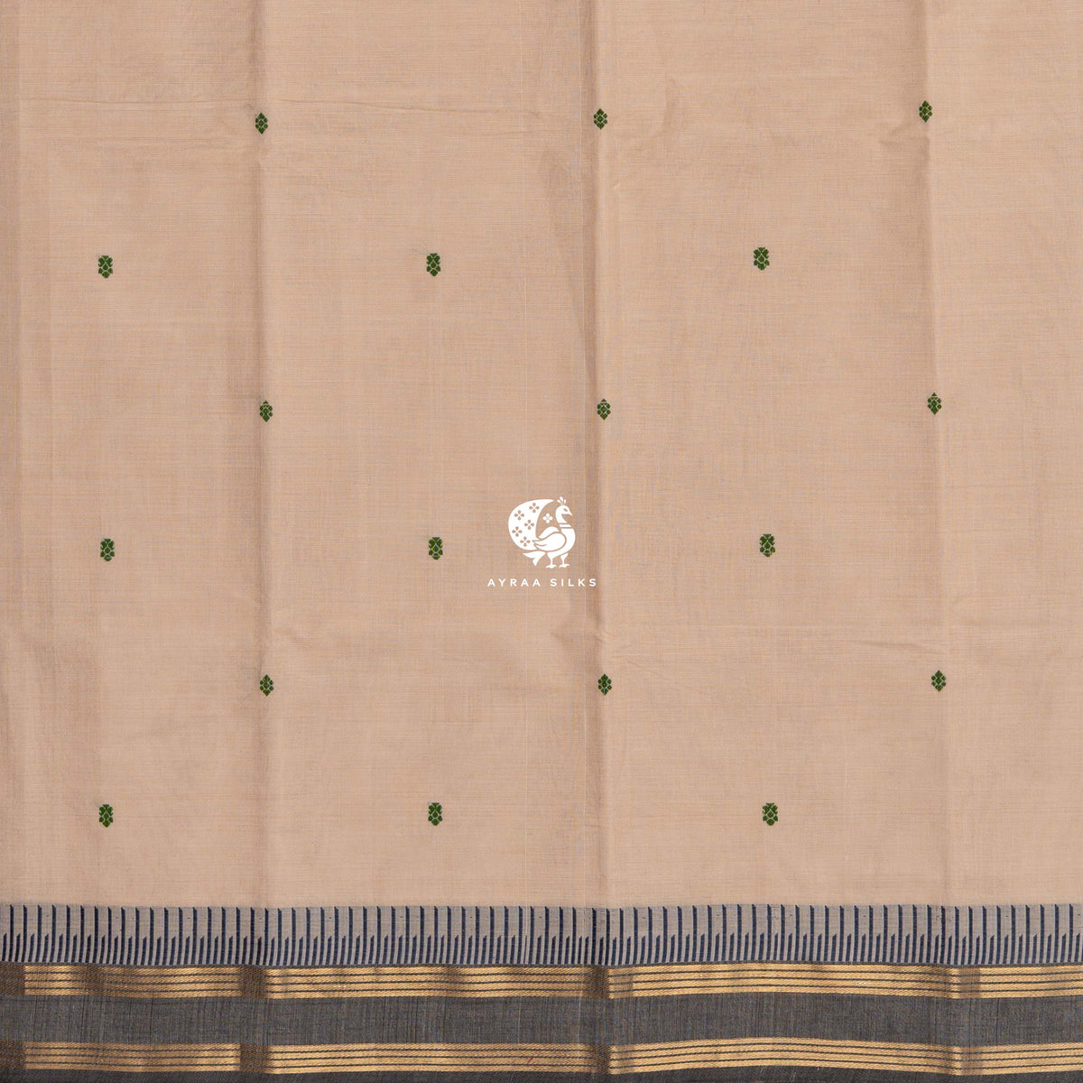 Green thread buttas across the beige body, meeting the charcoal grey zari border