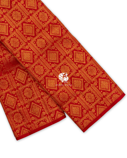 Red Zari Brocade Kanchipuram silk saree folded, showing the borderless edge with all-over zari in square and diamond frames