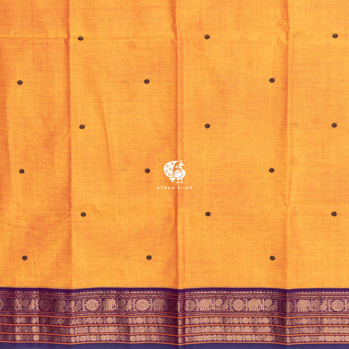 Mustard Kanchi cotton saree laid flat, pallu with purple buttas and Ganga Jamuna elephant zari borders