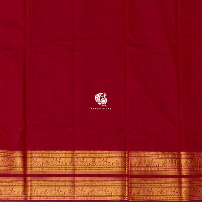 Plain red cotton body meeting the broad self colour gold zari border