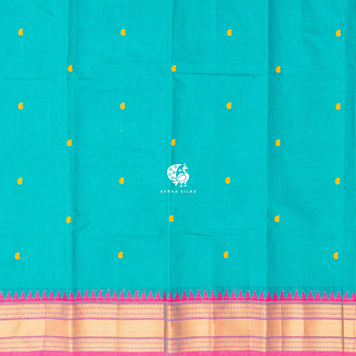 Yellow thread buttas across the teal green body, meeting the pink zari temple border