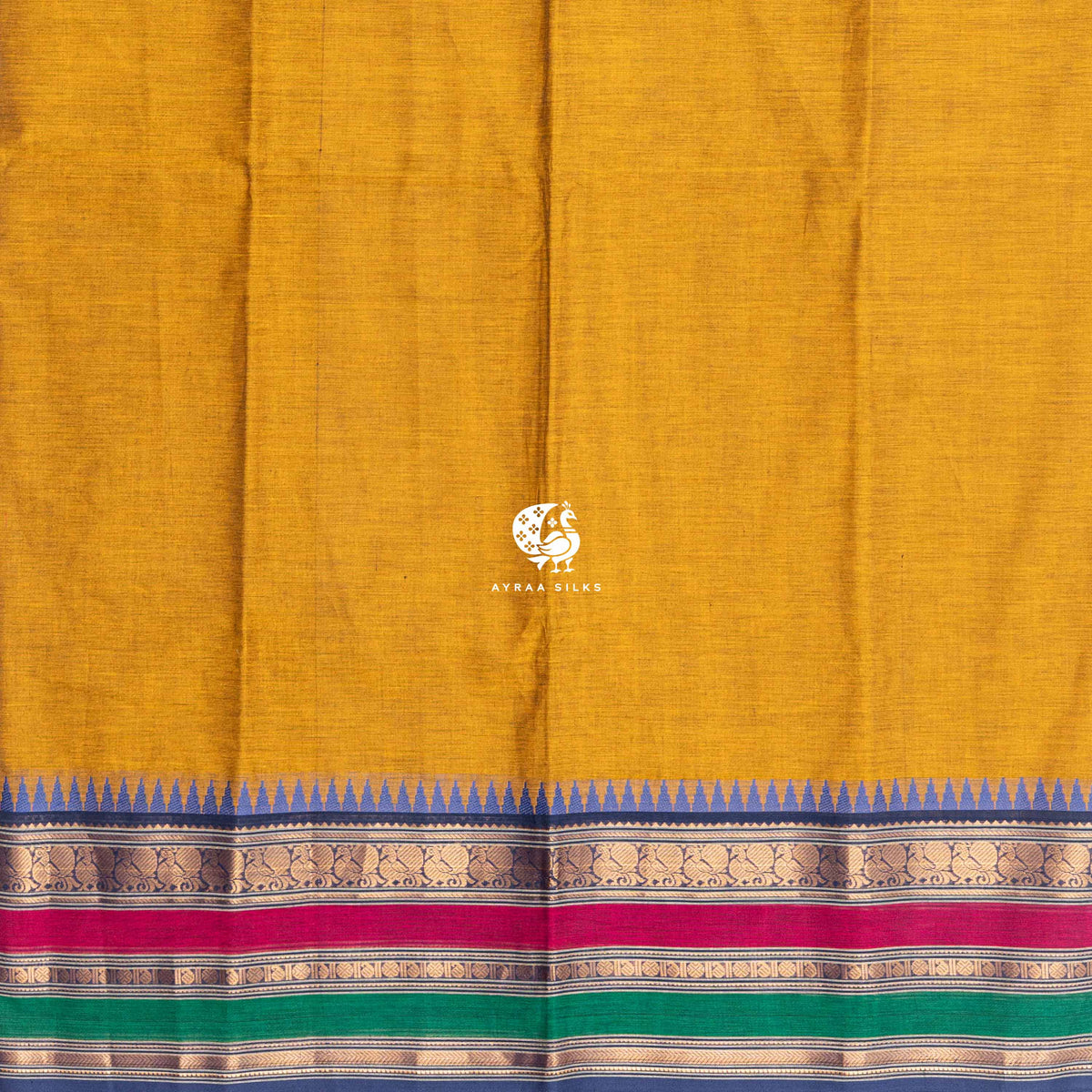 Plain mustard cotton body meeting the blue temple kumbam border