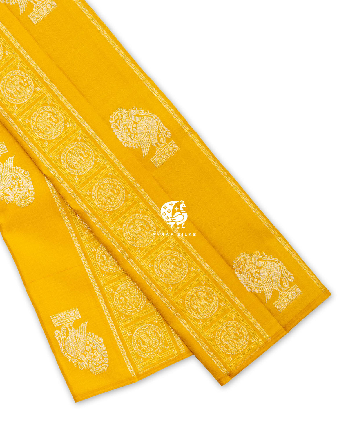 Mustard yellow pure Kanchipuram silk saree folded, showing the borderless body with zari elephant bands and Annam buttas