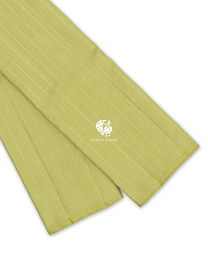 Pista Green Zari Vari Kanchipuram silk saree folded, showing the borderless edge with fine silver zari lines