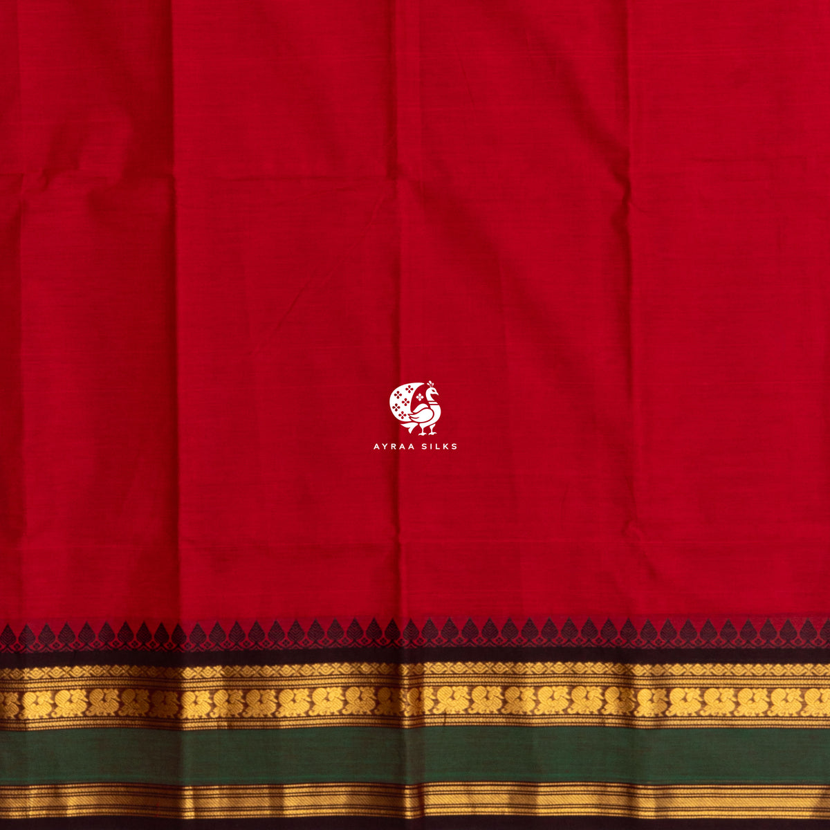 Plain red cotton body meeting the black temple kumbam border