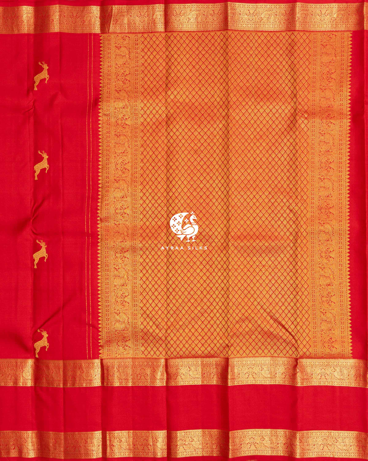 Red zari pallu in diamond weave with Mayil (peacock) side borders beside the red body with deer zari buttas