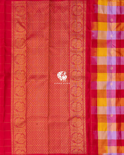 Contrast red zari pallu with Mayil Chakra (peacock medallion) side borders beside the multicolour checked body