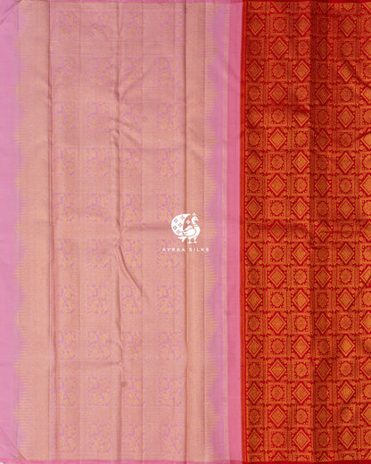 Contrast baby pink zari pallu with temple edges beside the red zari brocade body of the Kanchipuram silk saree