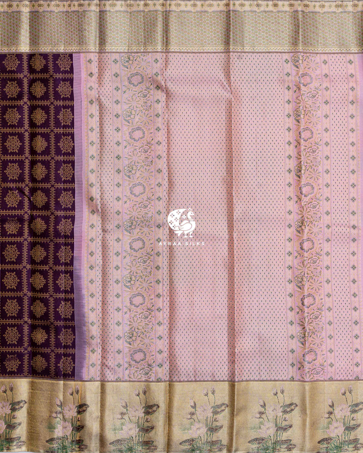 Contrast pastel pink zari pallu in a diamond lattice with floral bands, beside the jamun purple kolam body and gold lotus border