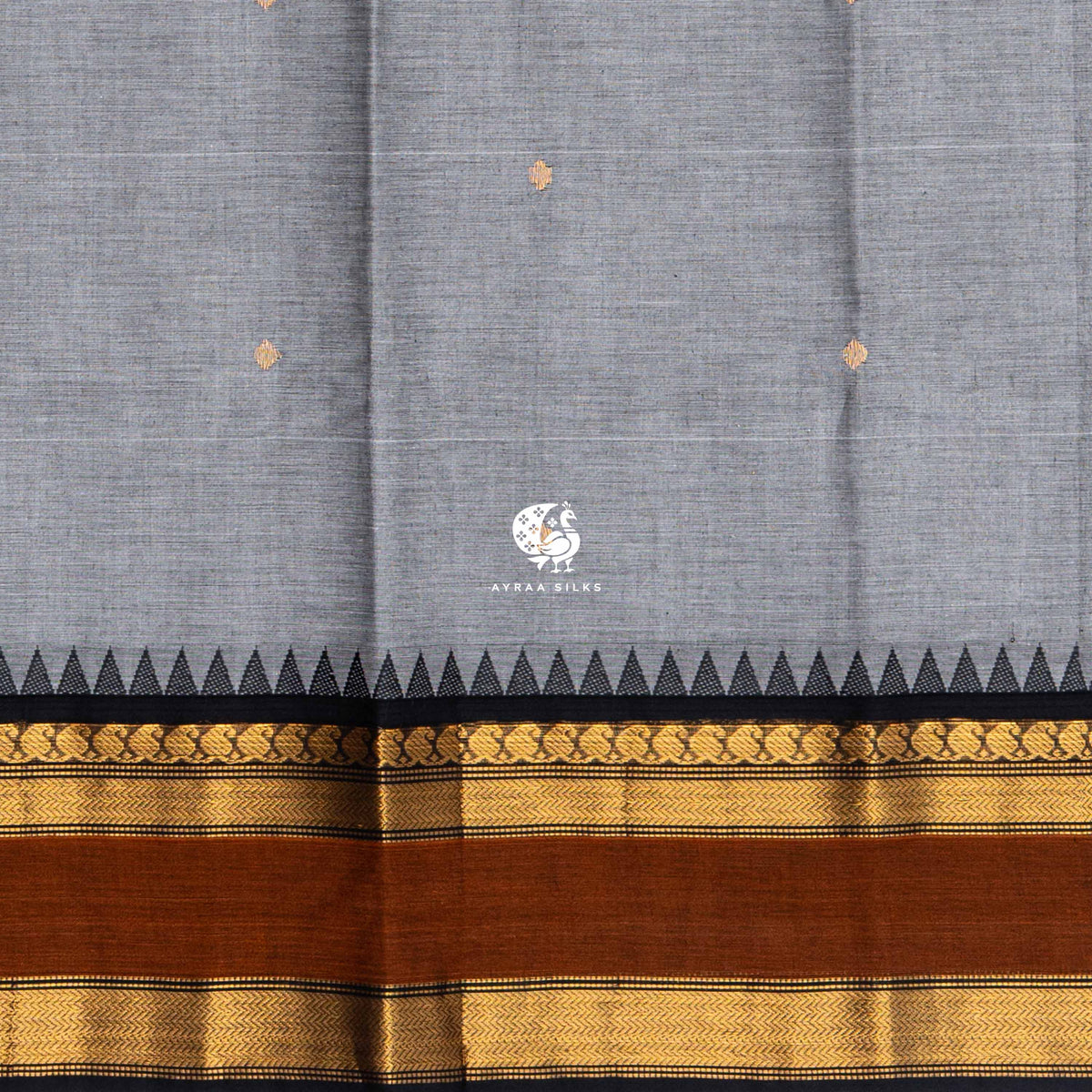 Close view of the gold zari buttas woven into the grey Kanchi cotton body