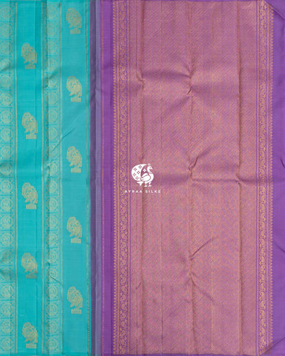 Turquoise blue Kanchipuram silk saree body with contrast lavender zari pallu and manga (paisley) scroll borders