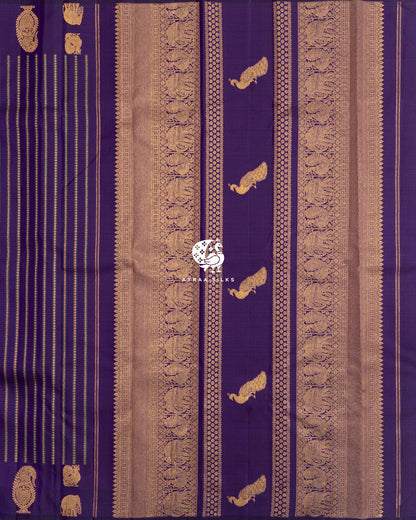 Purple zari pallu with bands of elephant and manga motifs and Mayil (peacock) zari buttas, beside the zari-striped body