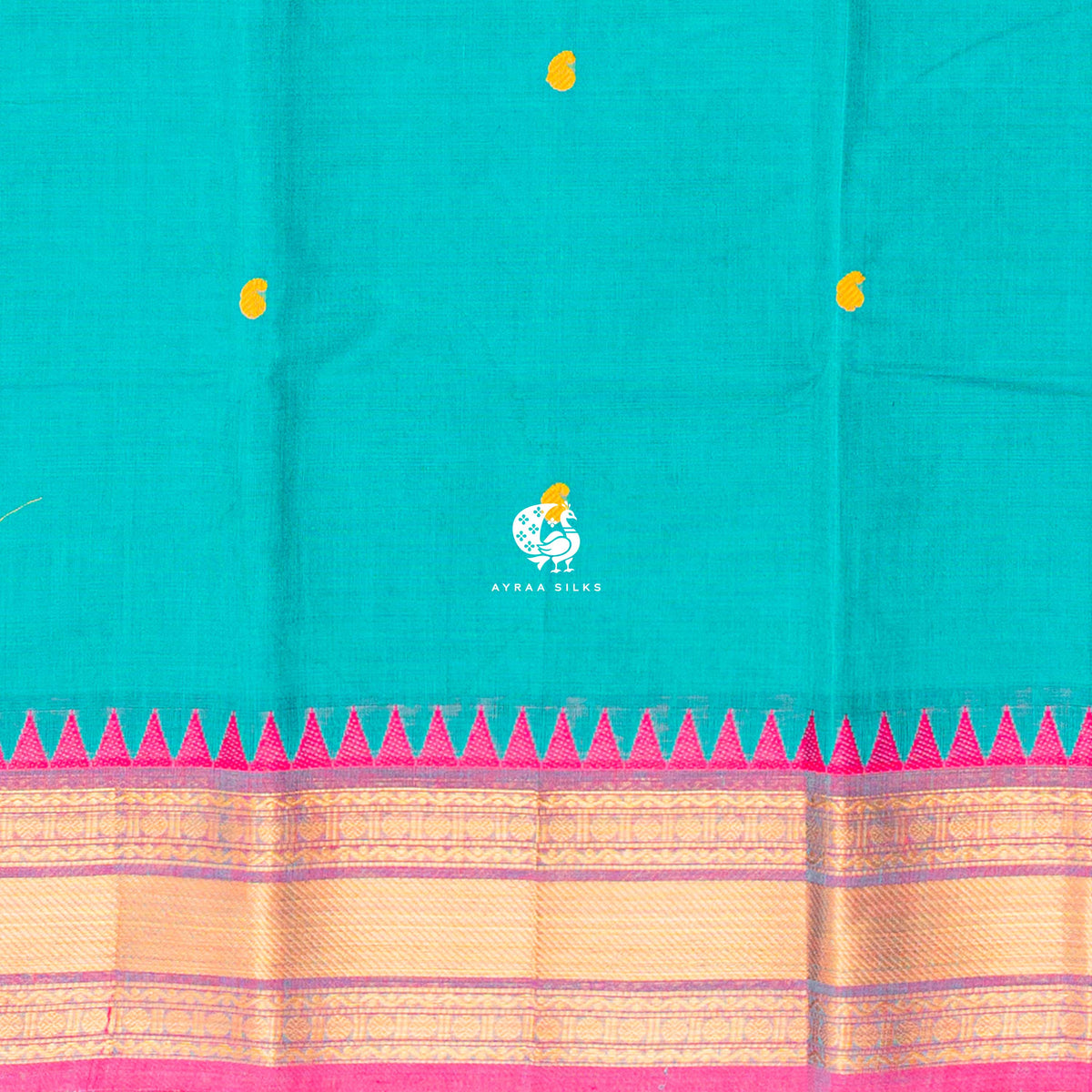 Close view of the yellow buttas woven into the teal green cotton body
