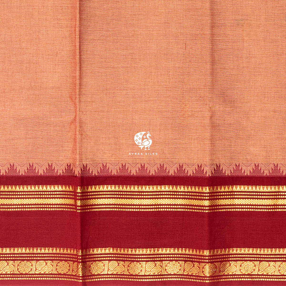 Close view of the running blouse and brick red and gold zari border with floral roundels and temple points