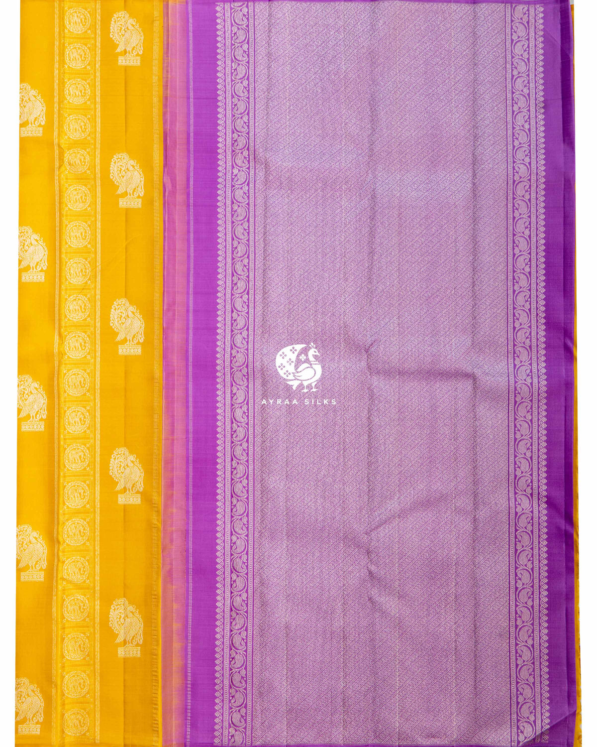 Contrast lavender silver zari pallu with purple paisley vine borders beside the mustard Annam and elephant body
