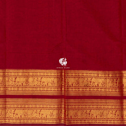 Close view of the running blouse and gold zari border with rows of elephants and peacocks on red