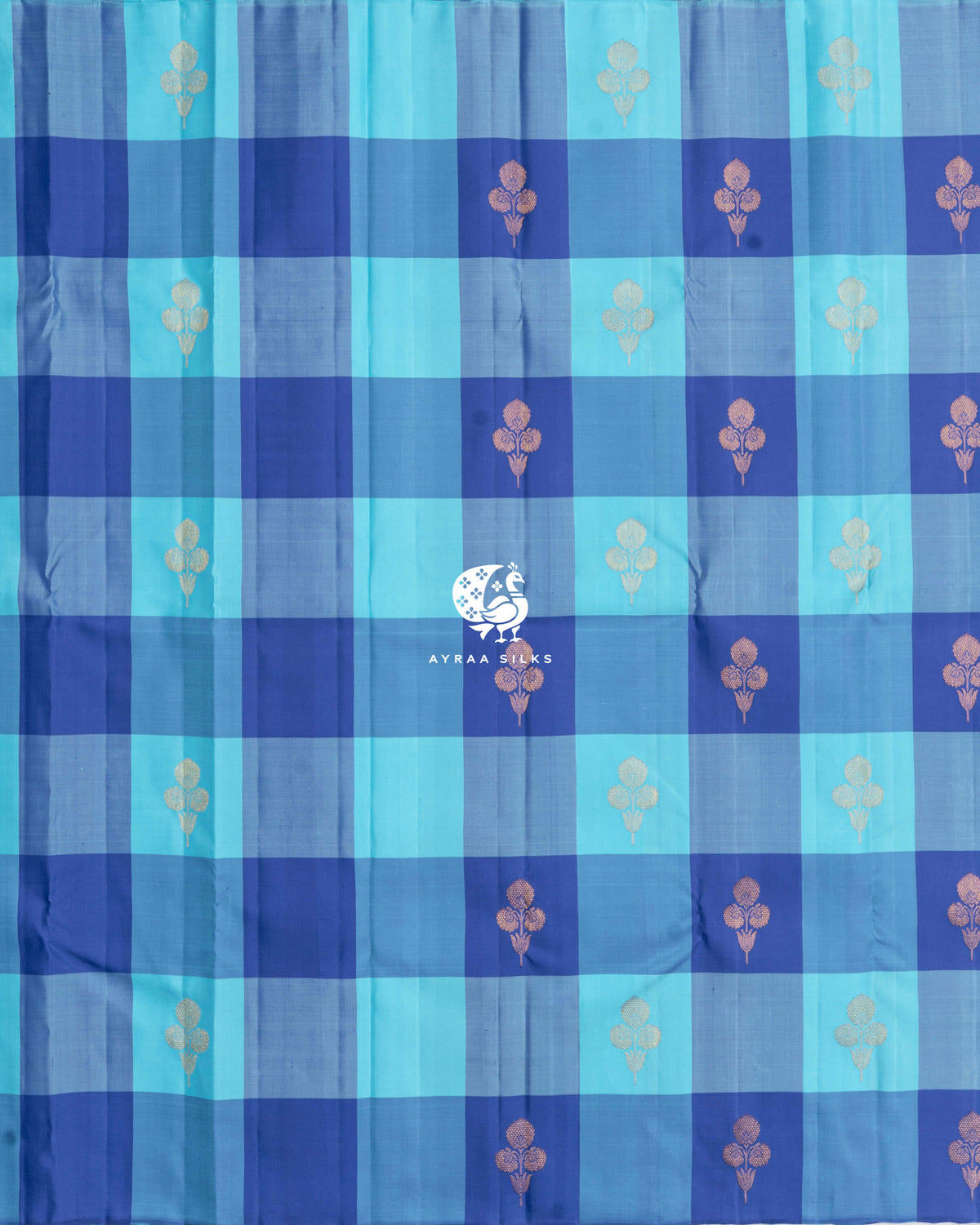 Full body view of the blue Kattam Kanchipuram silk saree with floral zari buttas across the checks