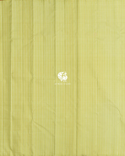 Full body view of the pista green Kanchipuram silk saree with silver zari stripes from edge to edge
