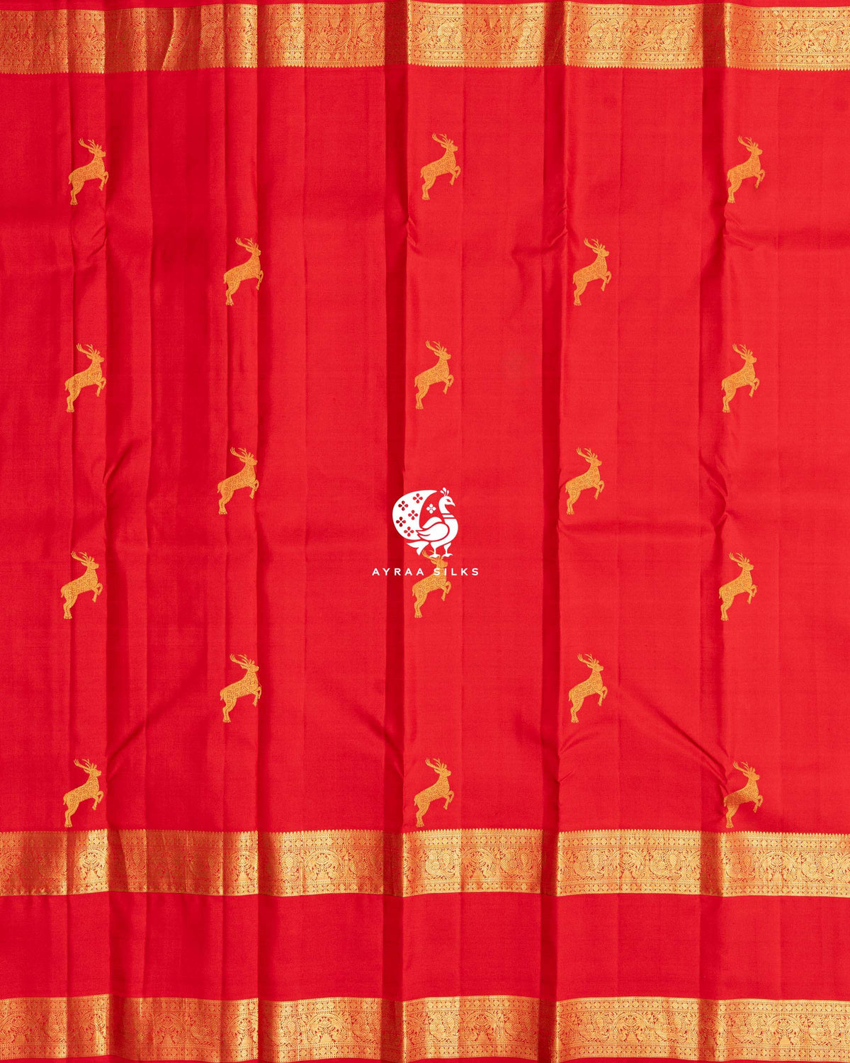 Full body view of the red Kanchipuram silk saree with rows of deer zari buttas and a Rettai Pettu zari border