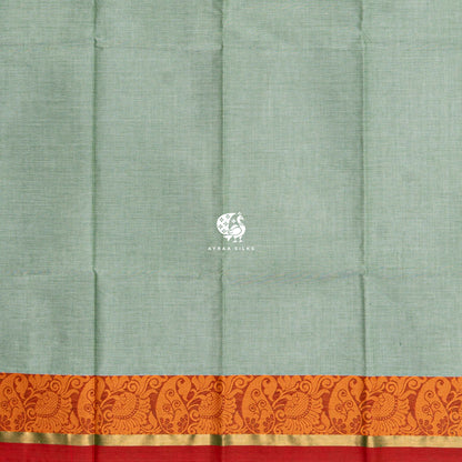Running blouse in the same sage green as the body, with the same orange thread border