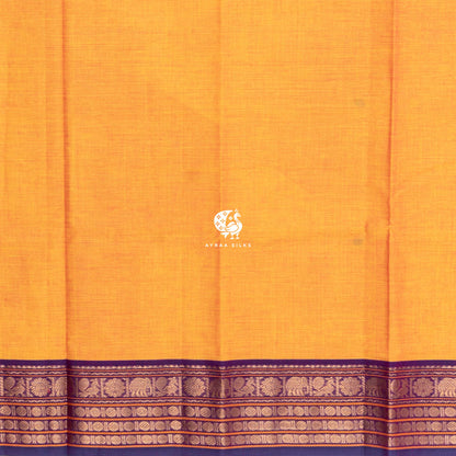 Plain mustard cotton running blouse meeting the purple and gold zari border