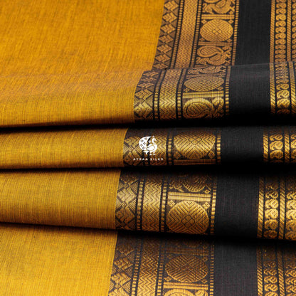Folded stack showing the mayil roundels along the black zari border